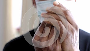 Man with sanitizing spray bottle spraying his hand beating the coronavirus stock footage