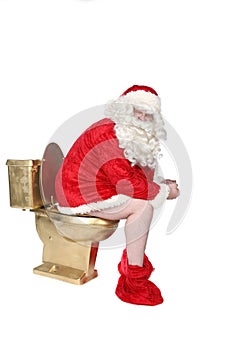 Man in Santa costume sitting on a golden toilet