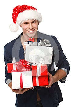 Man in Santa hat with many gift boxes