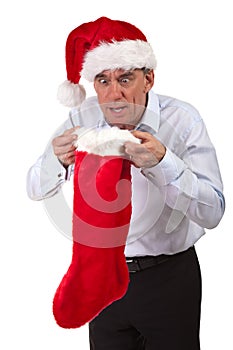 Man in Santa Hat Surprised at Stocking Contents