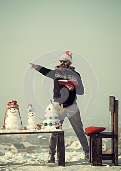 Man santa pointing finger on winter day