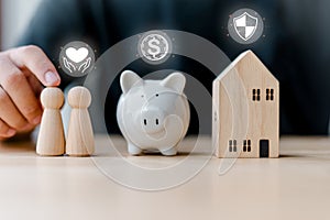 A man saves money to buy his own house and plans to create a warm and loving family. Saving money wealth investment real estate