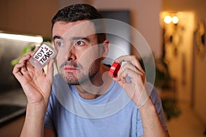 Man saving his tears in a bottle