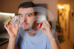 Man saving his tears in a bottle
