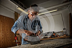 Man sawing a board