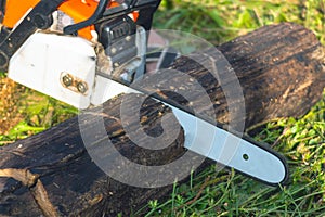Man is sawing a chain saw