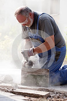 Man sawing with grinder