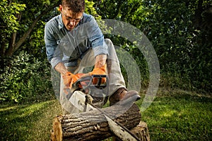 Man sawing a log