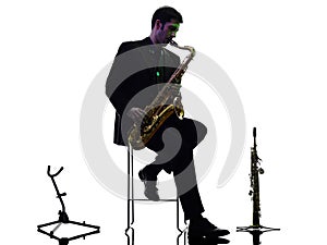 Man saxophonist playing saxophone player silhouette