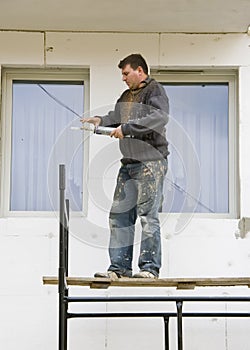 Man on scaffolding photo