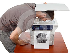 Man scanning his face in copier