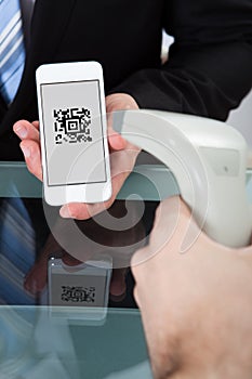 Man scanning a purchase code on a mobile