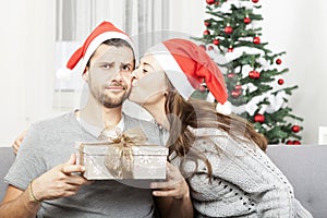 Man is sceptical about christmas gift photo
