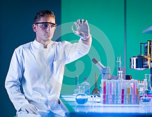 Man scientist analysing a petri dish