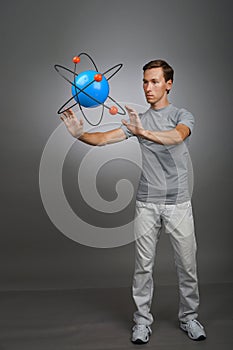 Man scientist with atom model, research concept
