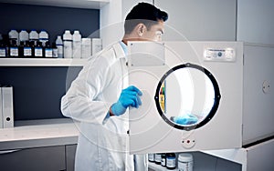 Man, scientist and laboratory autoclave equipment for medicine temperature control, medical research storage or chemical