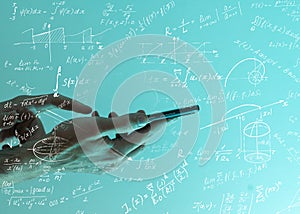 man scientist or student working with various high school maths and science formula.
