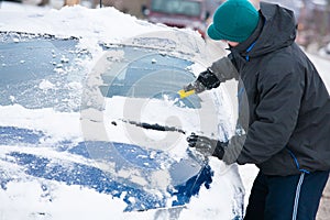 Man Scraping Ice off Car