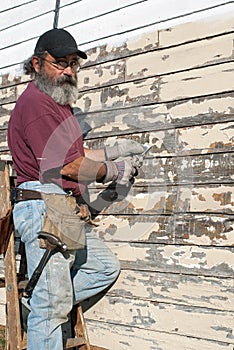 Man Scraping Paint