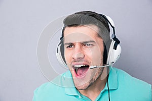 Man screaming in headset