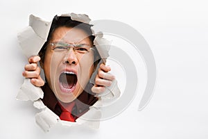 Man screaming from the hole in wall
