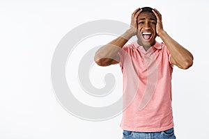 Man screaming out loud losing control of feelings, panicking not handling pressure standing troubled and concerned over