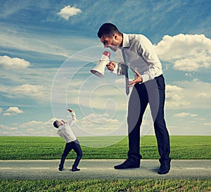 Man screaming at the small man