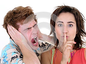 Man Screaming and Woman Making Silence Gesture