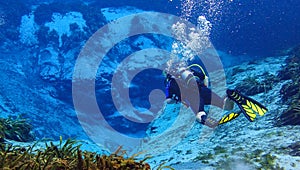 Man scuba diving in a spring in florida