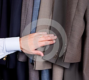 Man searching through suits