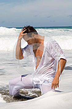 Man in the seaside with wet clothes