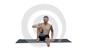 Man in Seated Marichyasana yoga pose stretching leg and spine exercise on white background.