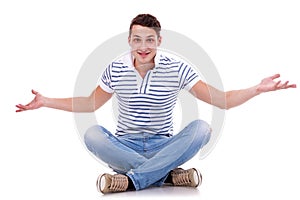 Man seated on studio, welcoming