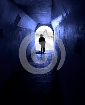 Man Seeking Jesus in Dark Tunnel photo