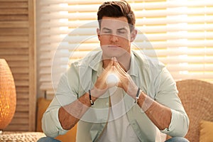 Man during self-healing session in room