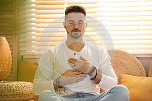 Man during self-healing session in therapy room