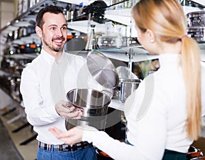 Man seller in dinnerware store