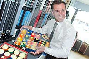 Man selling billiard accessories