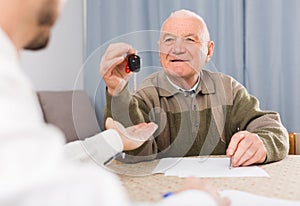 Man selling car at home