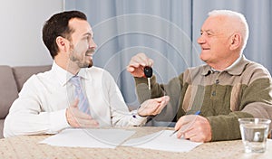 Man selling car at home