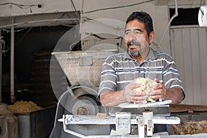 Man selling dough in nixtamal mill