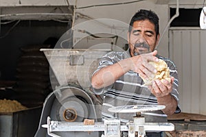 Man selling dough in nixtamal mill