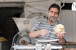 Man selling dough in nixtamal mill