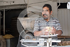 Man selling dough in nixtamal mill photo