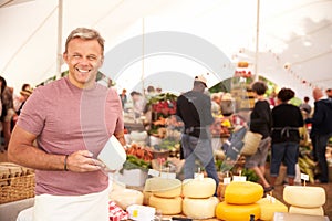 Man Selling Fresh Cheese At Farmers Food Market