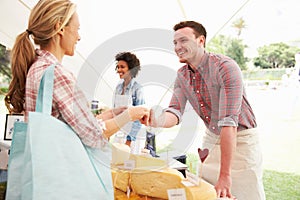 Man Selling Fresh Cheese At Farmers Food Market