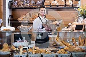 Man selling fresh pastry and baguettes