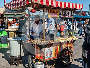 Man selling Roasted Chestnuts and Corns at Eminonu. Istanbul