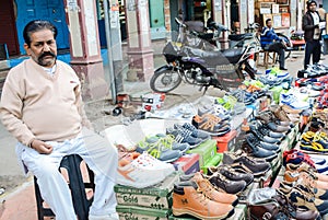 A man selling shoes