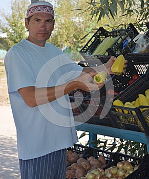 A man sells fruit and vegetables